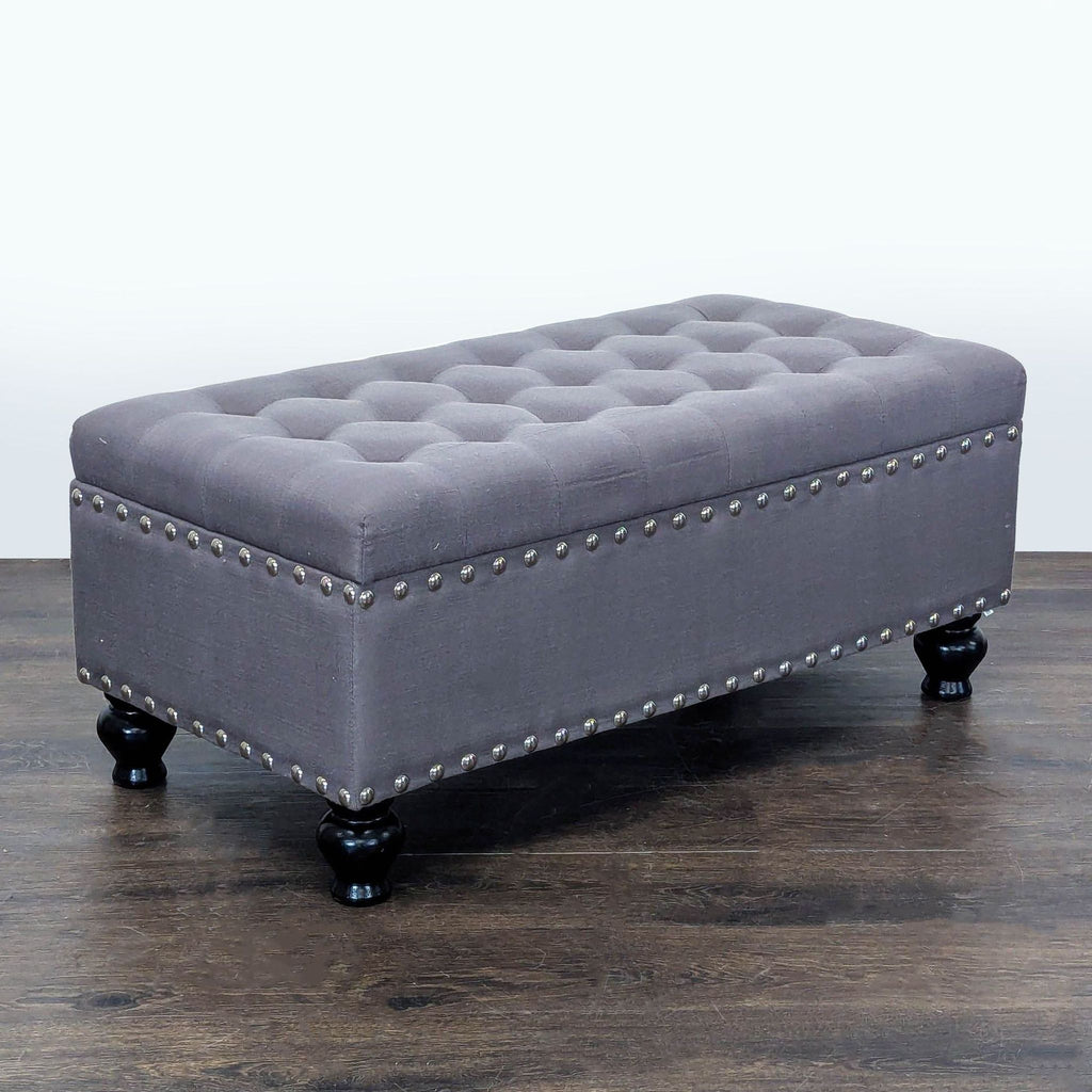 2. Elegant Marshall’s bench featuring button tufting and metallic nailhead accents, perfect as an ottoman or stool.  