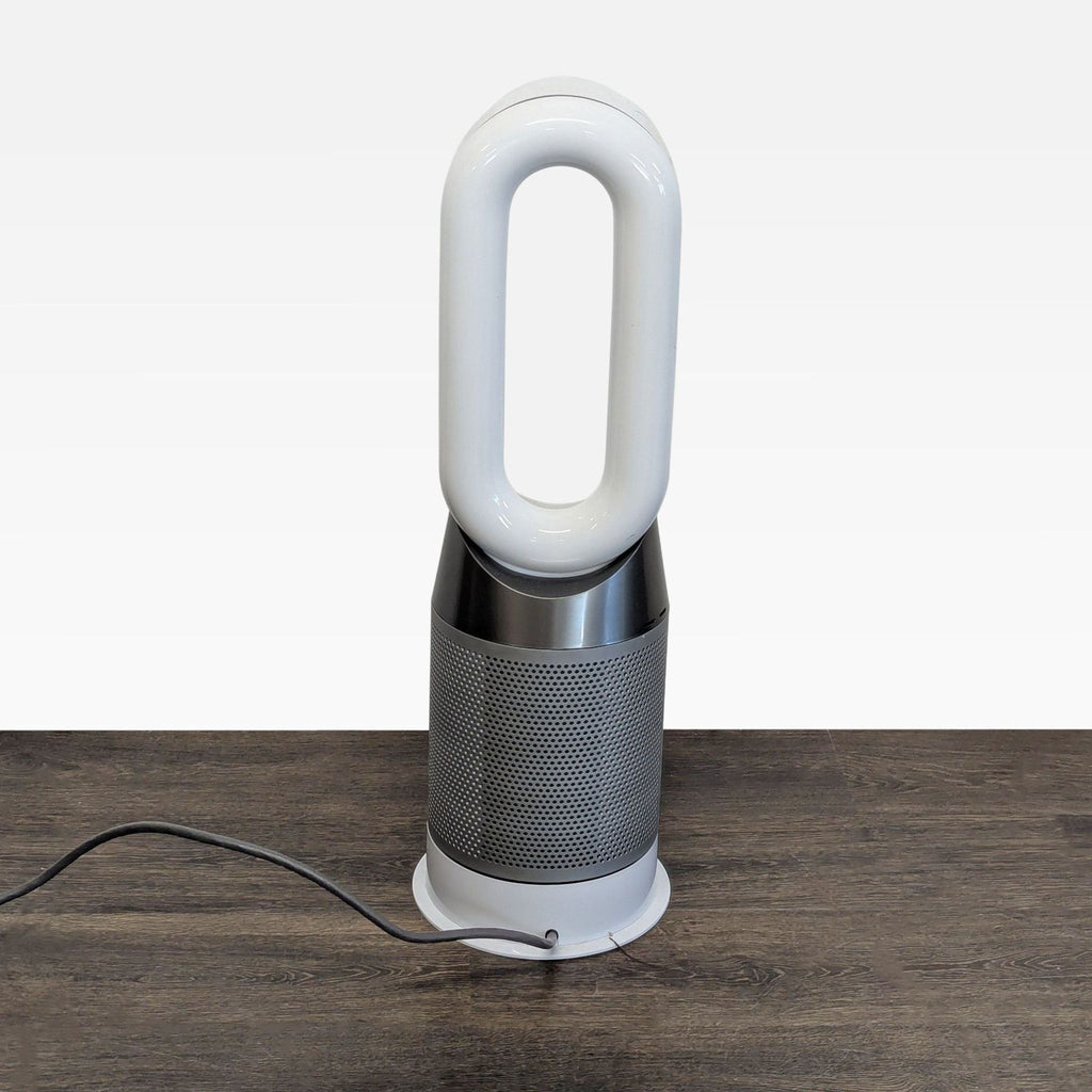 Stylish Dyson AC & fan unit, efficiently purifying and cooling indoor air while fitting neatly into any space.