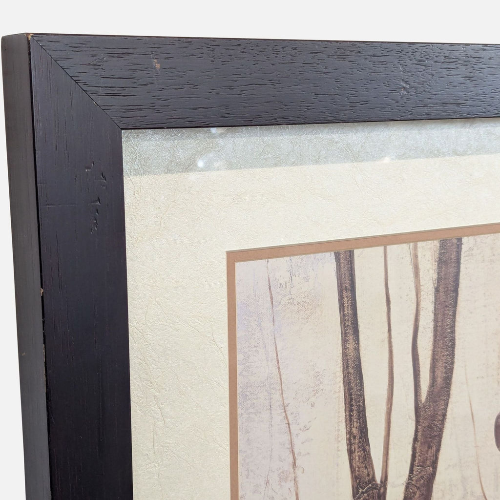 Nature-inspired drawing in a dark wood frame by Mary Calkins, featuring simple branches, leaves, and seed pods.