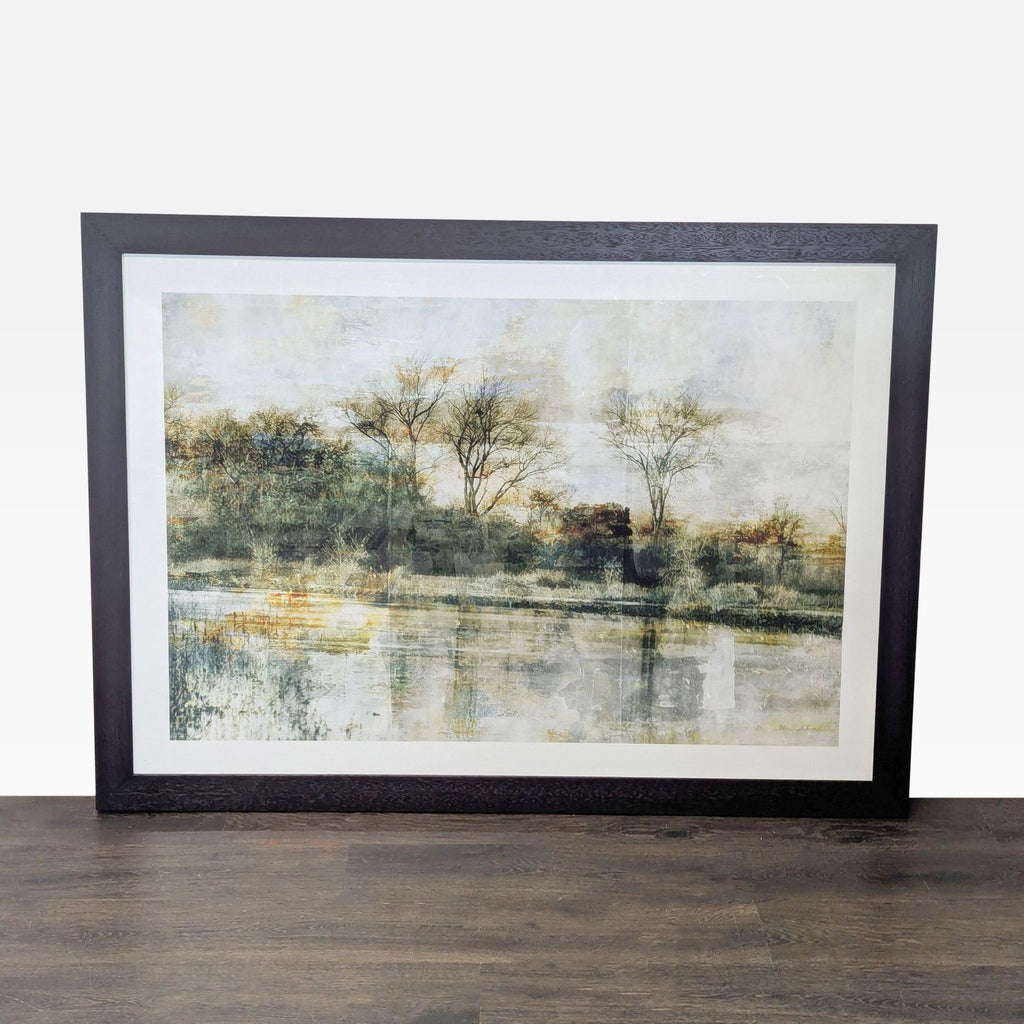 Framed landscape print with serene trees and water reflections, designed by Thea Schrack for Crate & Barrel.