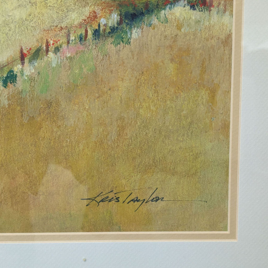 Countryside artwork in dark wood and gold frame, signed by artist Kris Taylor, with tranquil hills and homes.