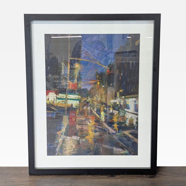 Framed painting by Steven Larson depicts a vibrant city street at night with bold, colorful brushstrokes.
