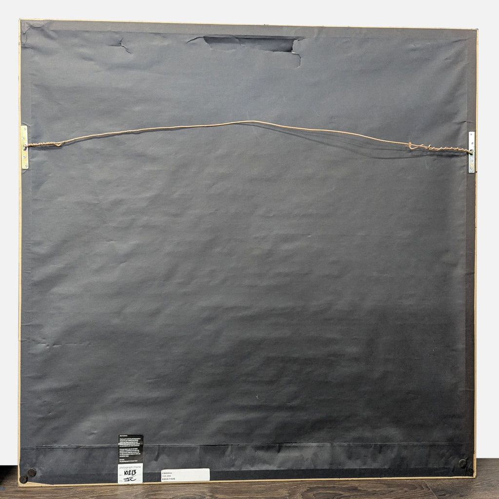 Abstract landscape wall art with blue, gray, and brown tones in a ready-to-hang black frame, modern and subtle design.