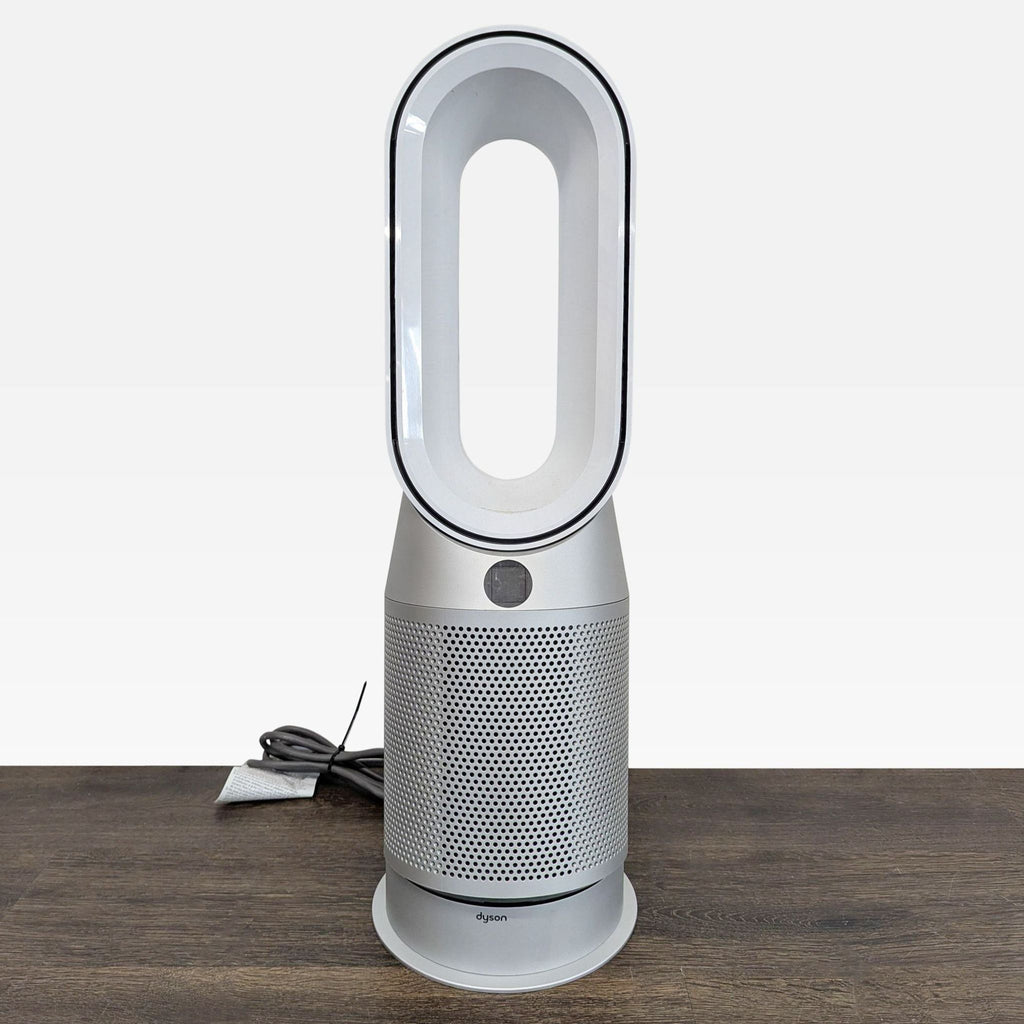 Dyson Pure Hot+Cool Link air purifier, heater, and fan with bladeless design, shown in a modern room.