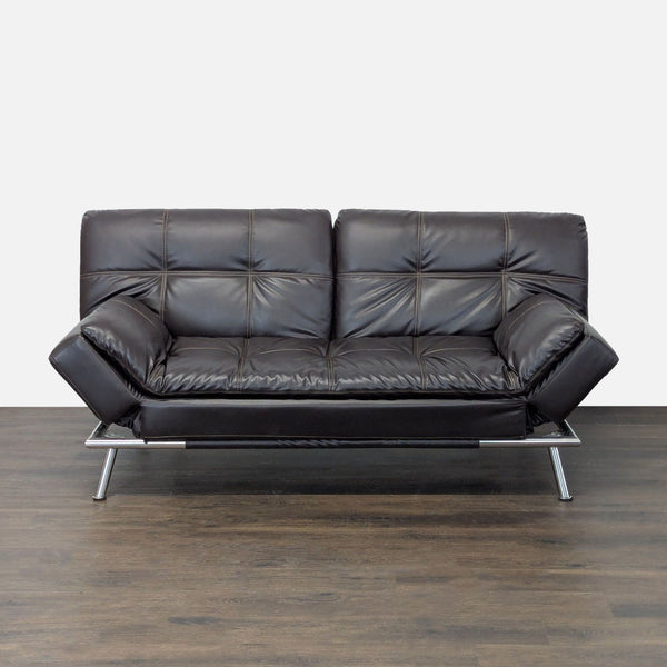 Sebu faux leather convertible sleeper sofa with tufted cushions and chrome frame in a minimalist modern style.