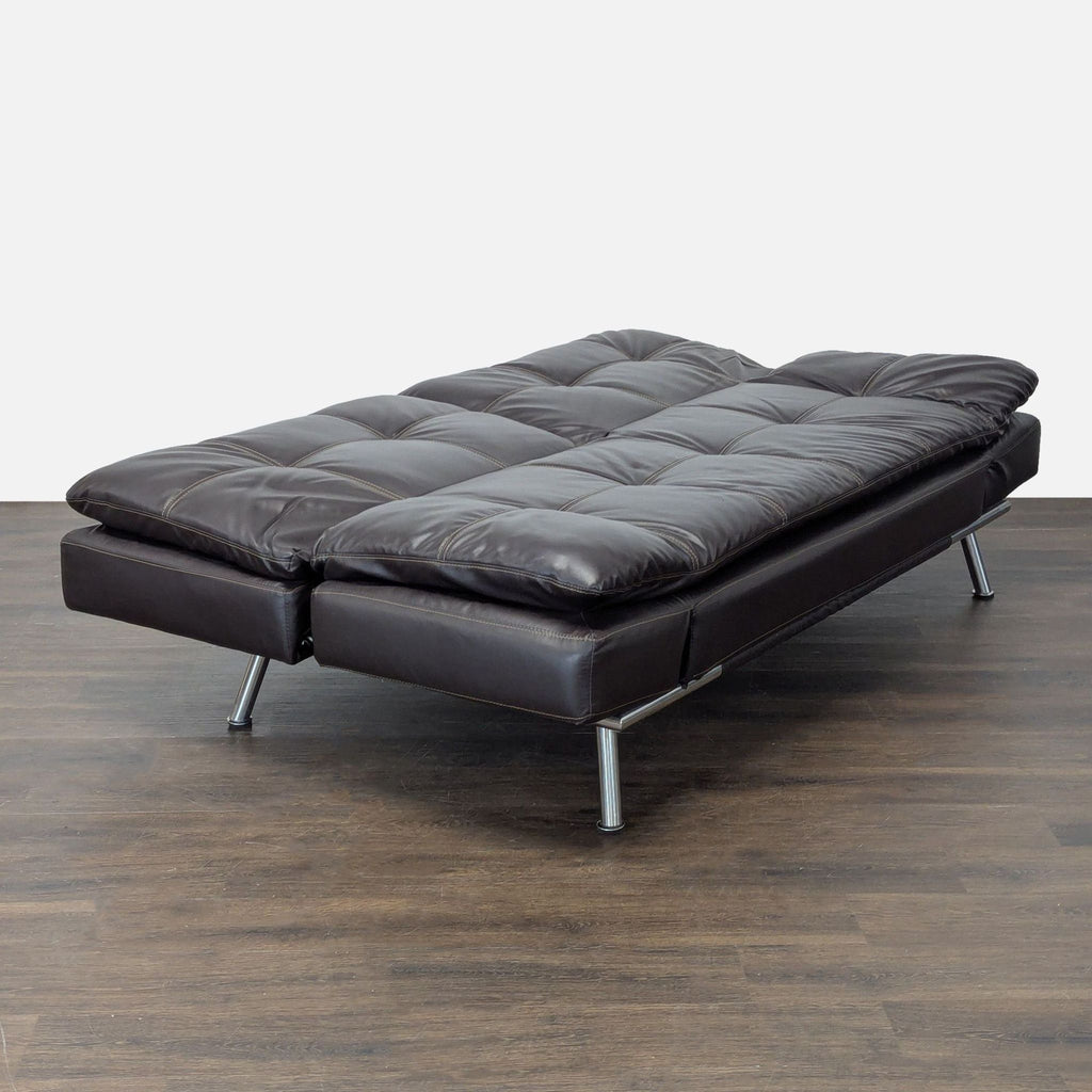 Modern Sebu sleeper sofa with padded armrests and tufted upholstery, convertible to guest bed for small spaces.