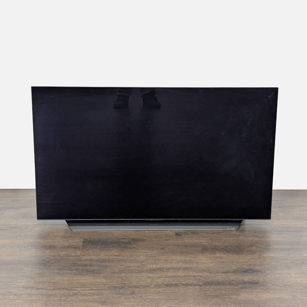 LG 4K TV with vivid colors, slim design, and sleek stand, perfect for modern home entertainment spaces.