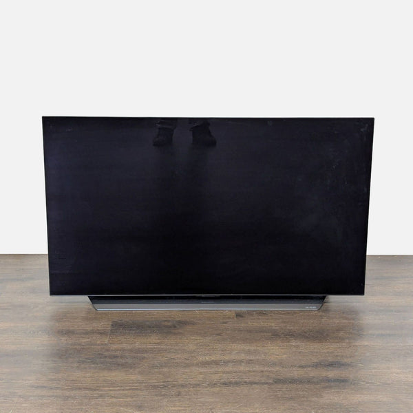 LG 4K TV with vivid colors, slim design, and sleek stand, perfect for modern home entertainment spaces.