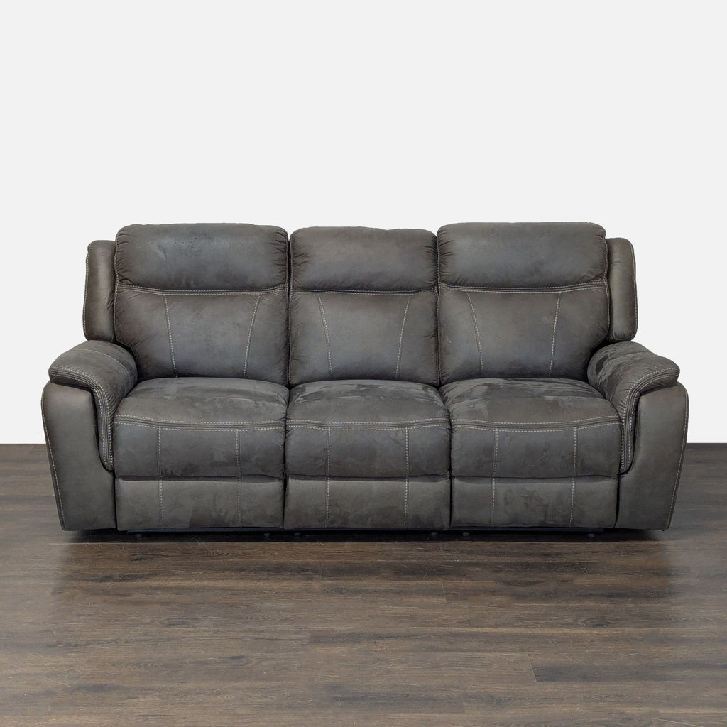 3-seat leather sofa with reclining ends, plush cushions, and padded armrests for extra comfort and durability.