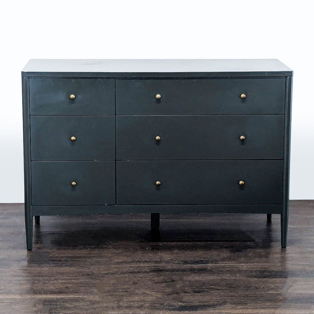 Sleek Crate & Barrel dresser with six drawers and minimalist gold knobs, ideal for modern or classic bedrooms.  