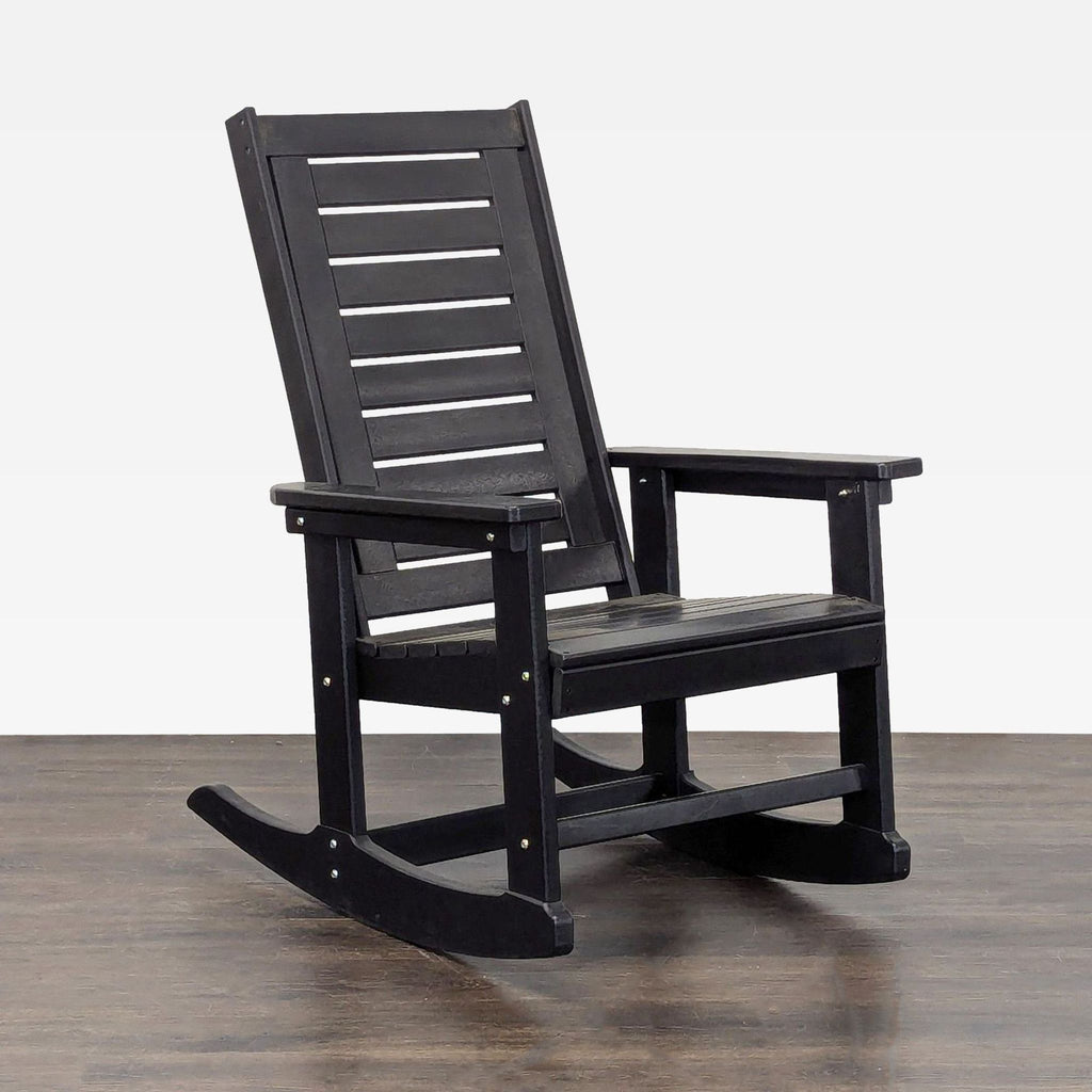 Classic black rocking chair for indoor or outdoor use, offering comfortable seating with supportive armrests.