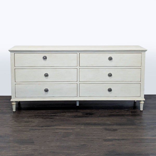 Antique white dresser by Restoration Hardware with six drawers and metal ring pulls in a classic design.  