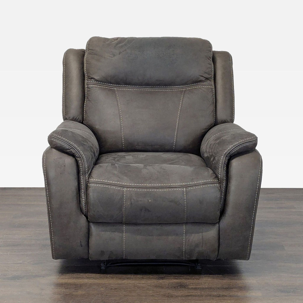 Plush dark gray power reclining lounge chair with padded armrests and high back, ideal for relaxation.