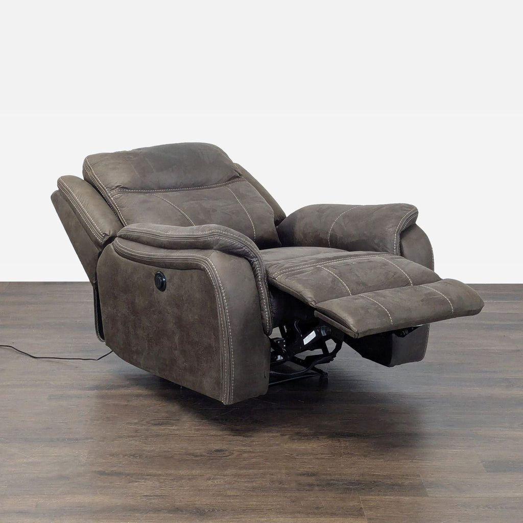 Modern lounge chair in dark gray fabric, featuring power recline, soft cushioning, and supportive high backrest.