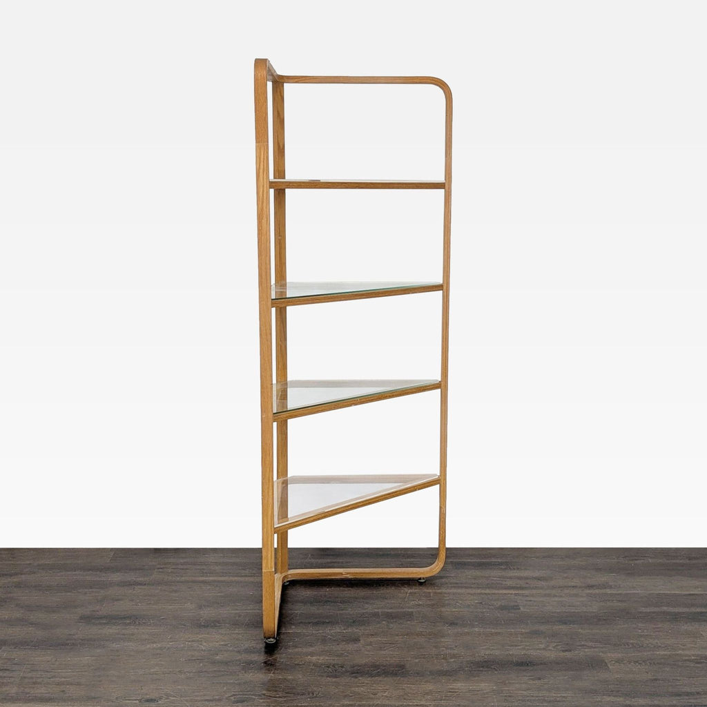 Modern triangular bookshelf featuring a sturdy wood build and sleek glass shelves for books or decor.