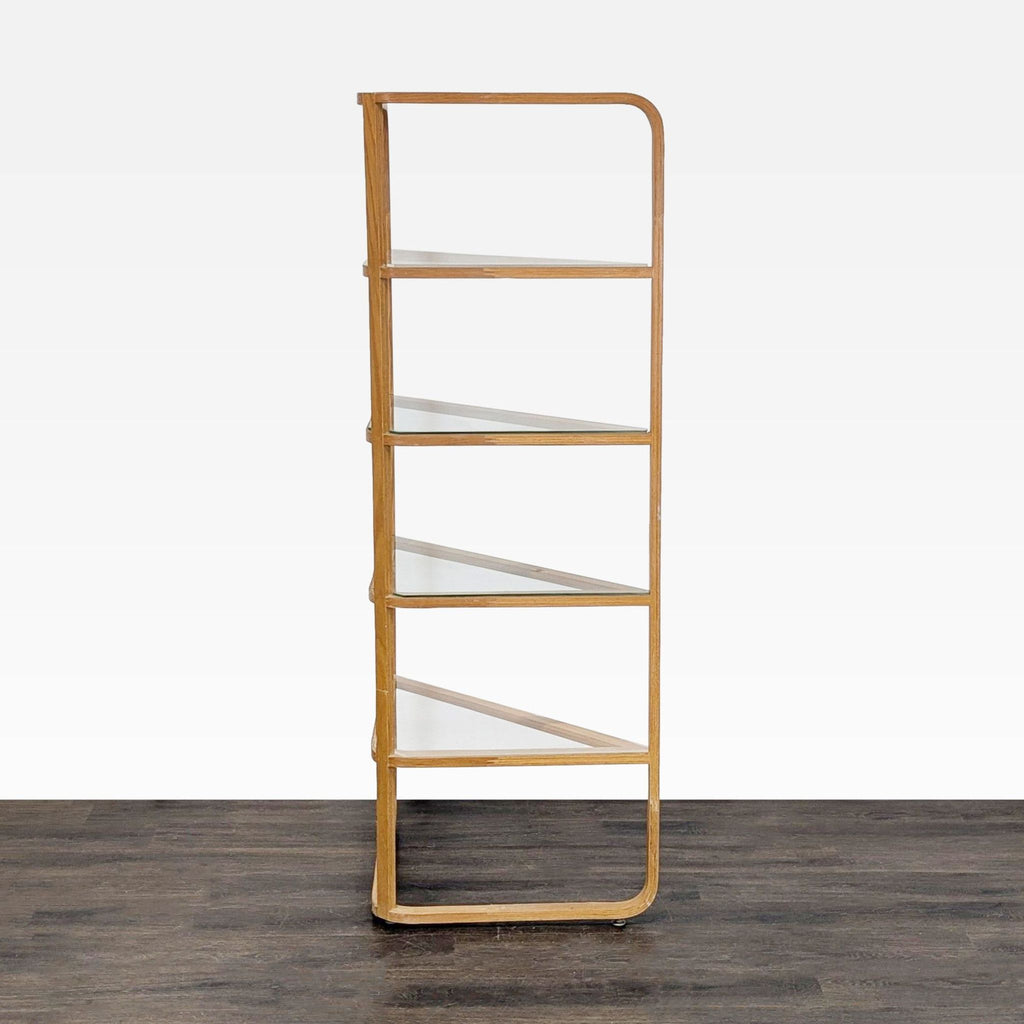 Space-saving corner bookshelf with four glass shelves and a wooden frame, ideal for displaying items.