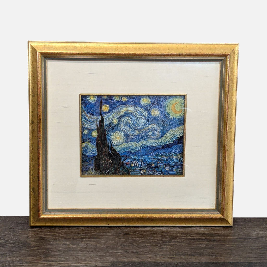 Framed art print of Van Gogh's "Starry Night" in a gold frame with a wide cream mat.