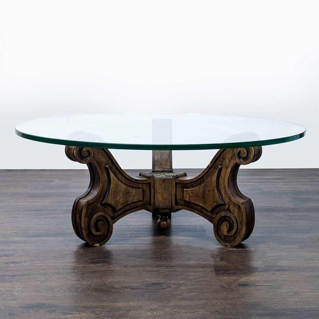 Mid-century coffee table with ornate Mediterranean-style carved wood base.