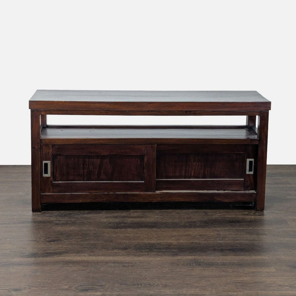 Dark wood cabinet with a spacious top, open shelf, and two sliding doors for hidden storage.