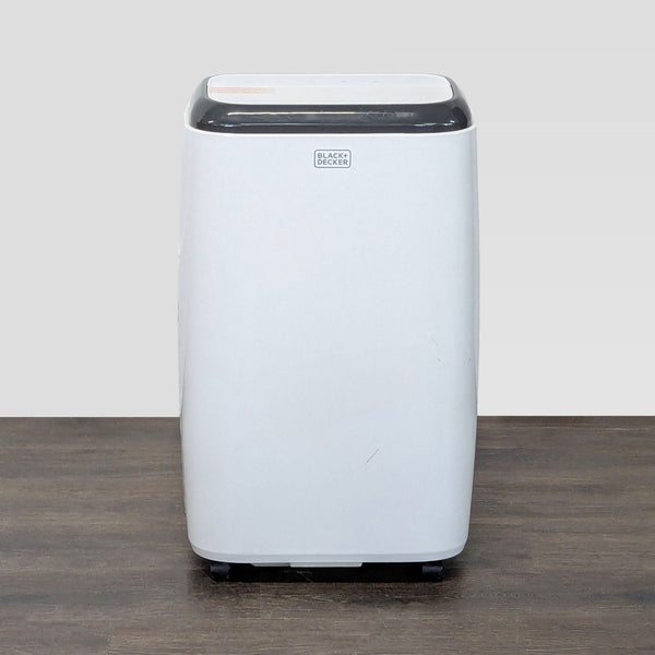 Black + Decker portable air conditioner with sleek design, compact size, and easy-to-use controls, perfect for small spaces.