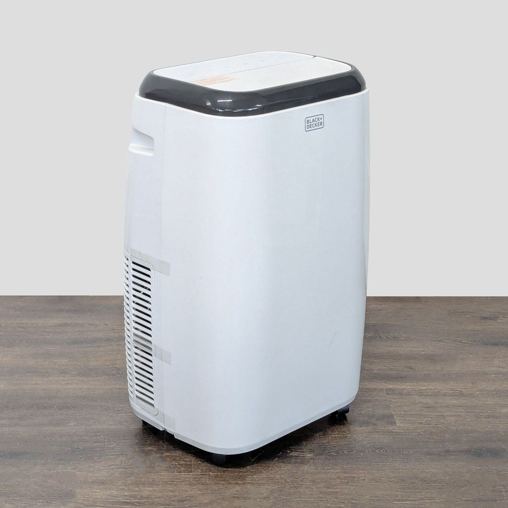 Sleek Black + Decker air conditioner, easy to move, featuring simple controls and space-saving style.  