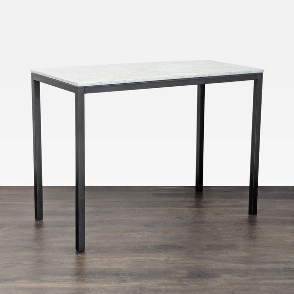 West Elm dining table with a Carrara marble top and black finished steel frame, highlighting natural veining.