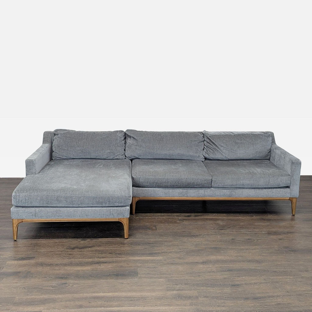 West Elm sectional sofa with a soft gray fabric, spacious chaise, and modern clean lines for living rooms.