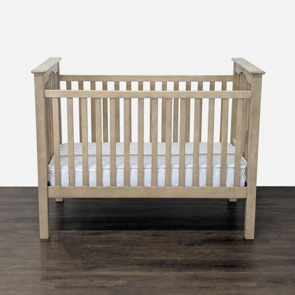 Pottery Barn Kids crib with mattress, sturdy wood frame, neutral finish, gently used, perfect for nursery.