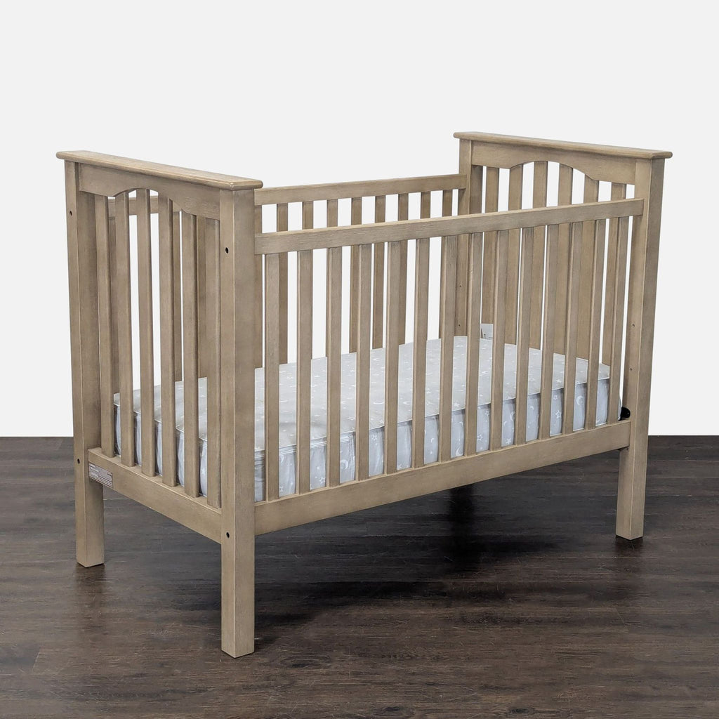 Convertible crib by Pottery Barn Kids, safe wood construction, neutral tone, fits any nursery, great condition.