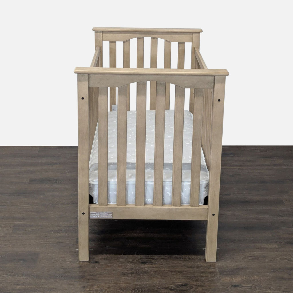 Kids & Toys category crib, Pottery Barn Kids brand, spacious, stylish neutral frame, mattress included, lightly used.