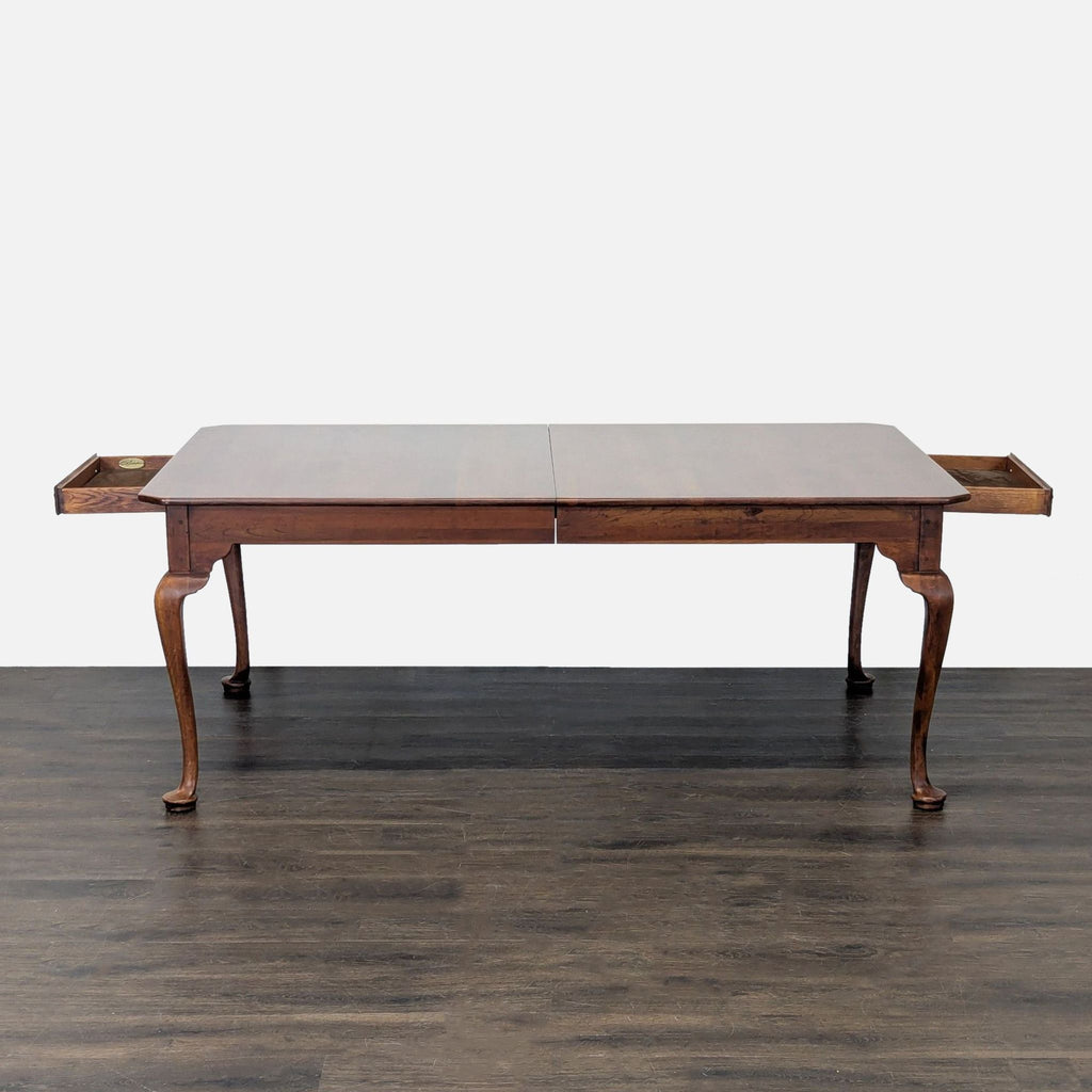 Elegant solid cherry dining set by Lexington featuring cabriole legs, velvety-lined drawers, and matching chairs.  