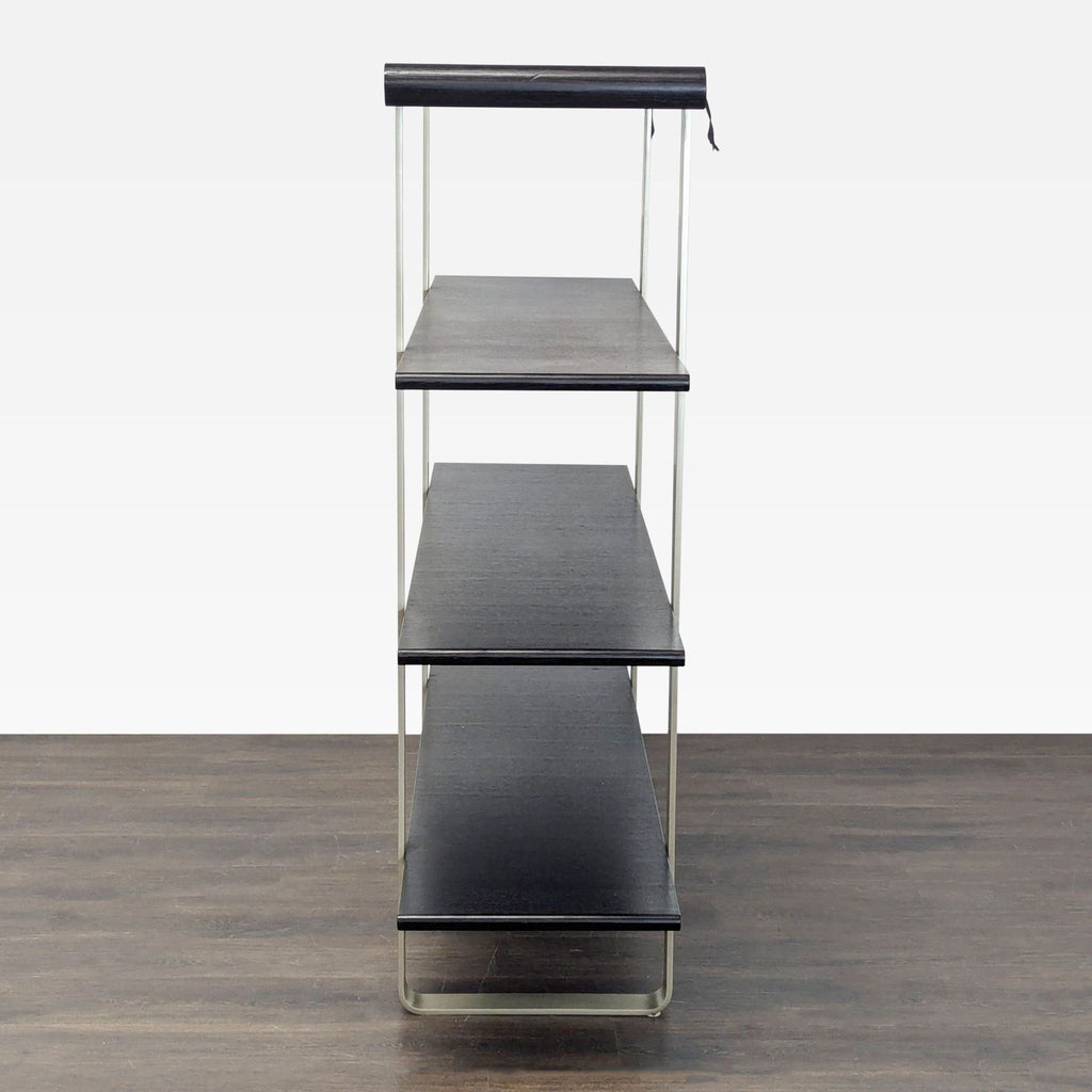 Contemporary bookshelf featuring sturdy black wood shelves and a minimalist metal structure, perfect for any room.