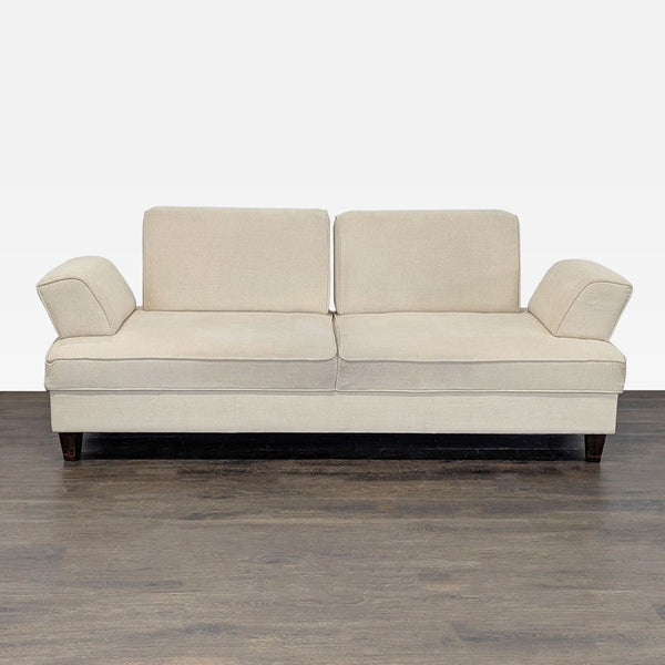 Beige Shermag Canada 3-seat sofa with modern design, plush cushions, wooden legs, and unique armrests.
