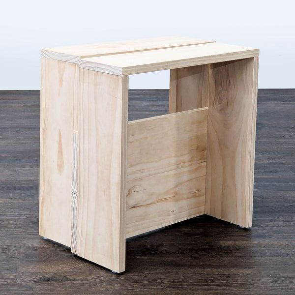 1. Unfinished pine wood piece from the brand Manual, shown in its raw, natural state.  