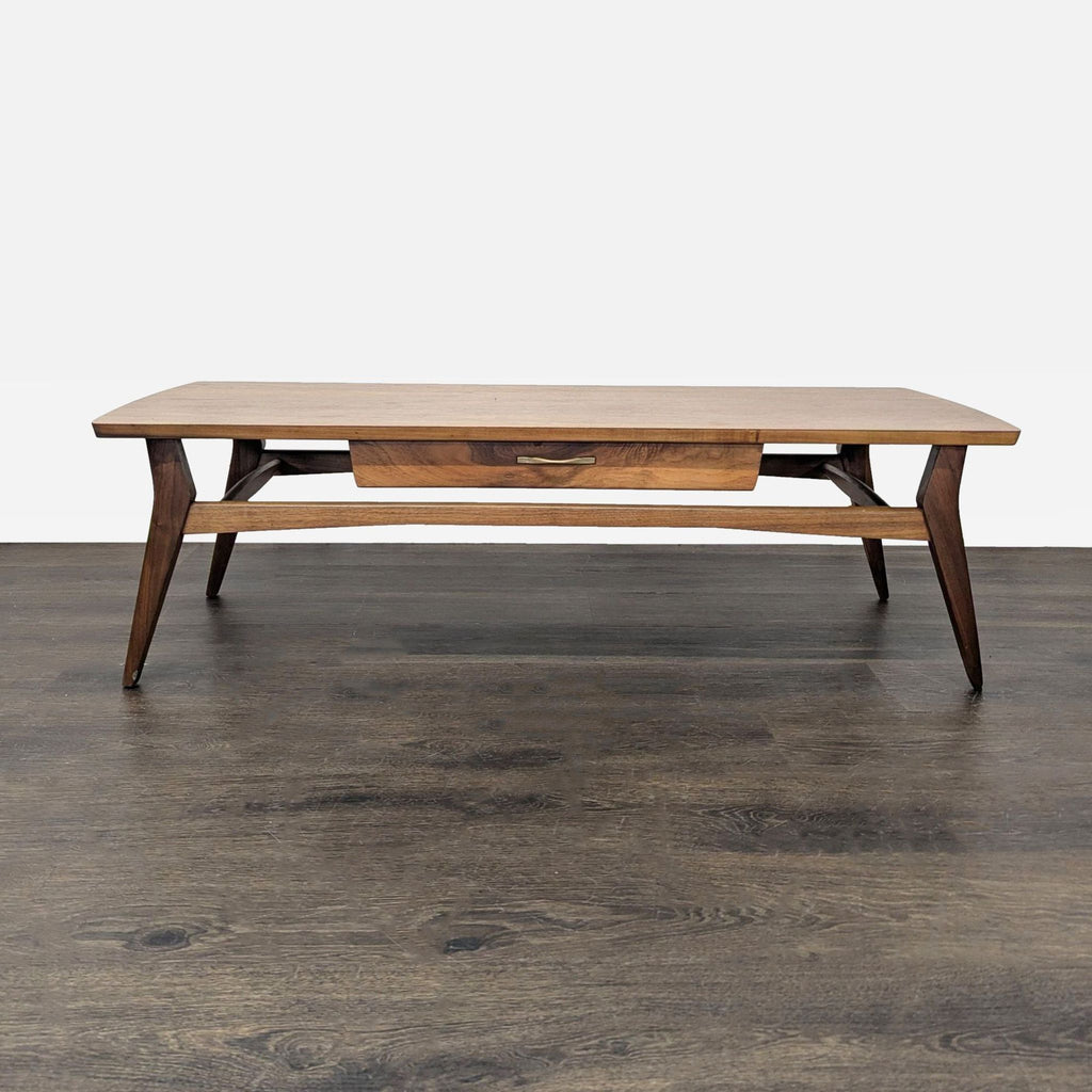 Mid-century walnut table featuring one drawer and unique sculpted metal handle, designed circa 1960s.