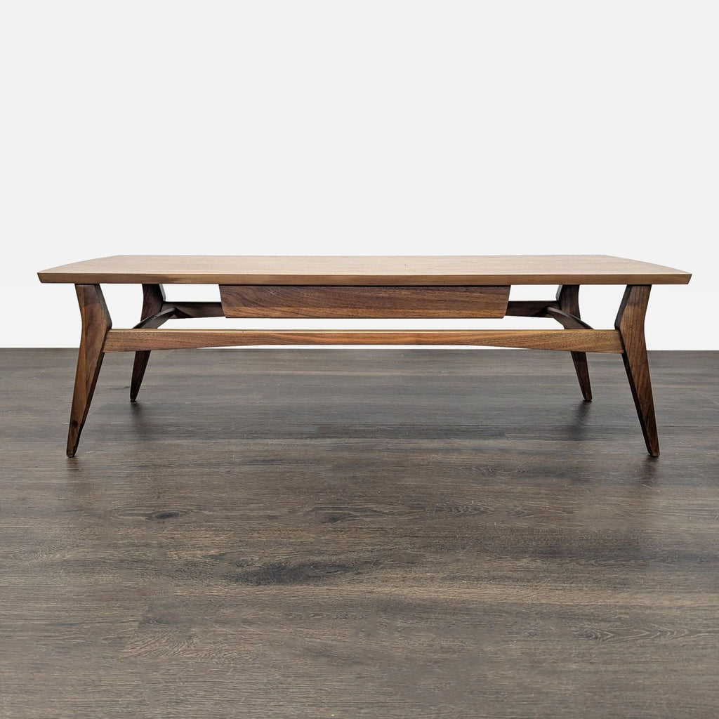 1960s walnut table with a single drawer and artistic metal hardware on the front, reflecting mid-century style.