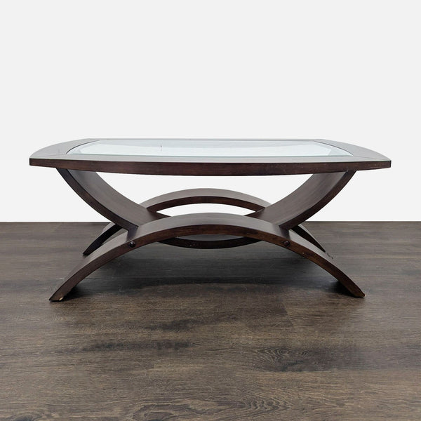 Curved-leg coffee table with a beveled glass top by Magnussen Home.  