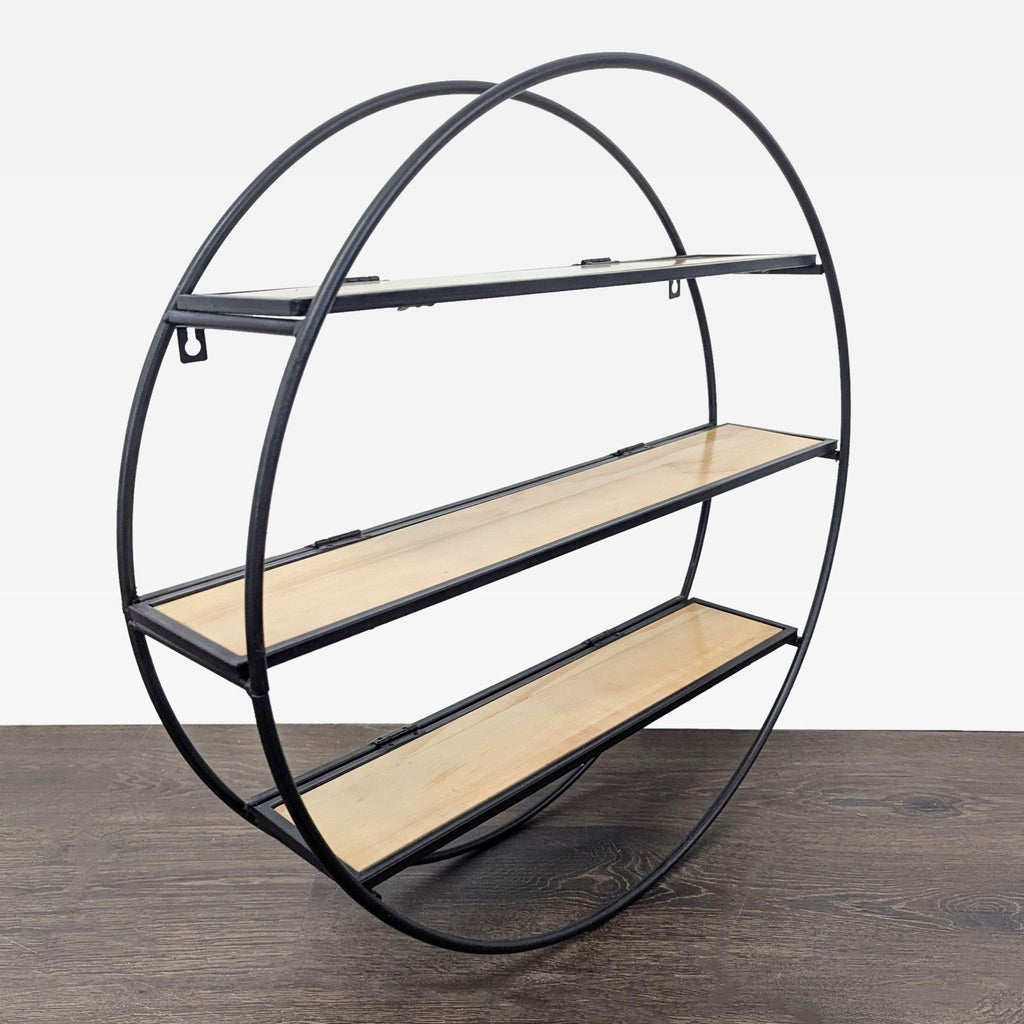Industrial-style round wall shelf from World Market with open black metal frame and three wooden shelving spaces.