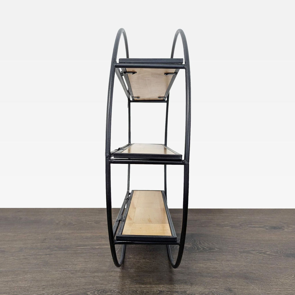 Minimalist circular bookshelf by World Market, featuring matte black frame and three natural wood display tiers.