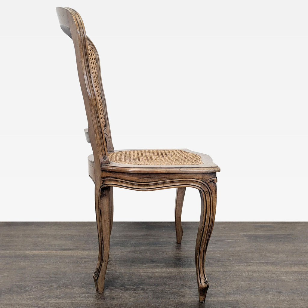 Classic dining chair with carved wood details and cane weaving on seat and back.