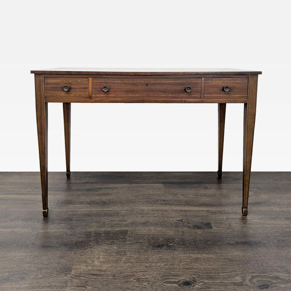 Refined neoclassical side table from circa 1790 with inlay, dovetail drawers, and tapered legs.  