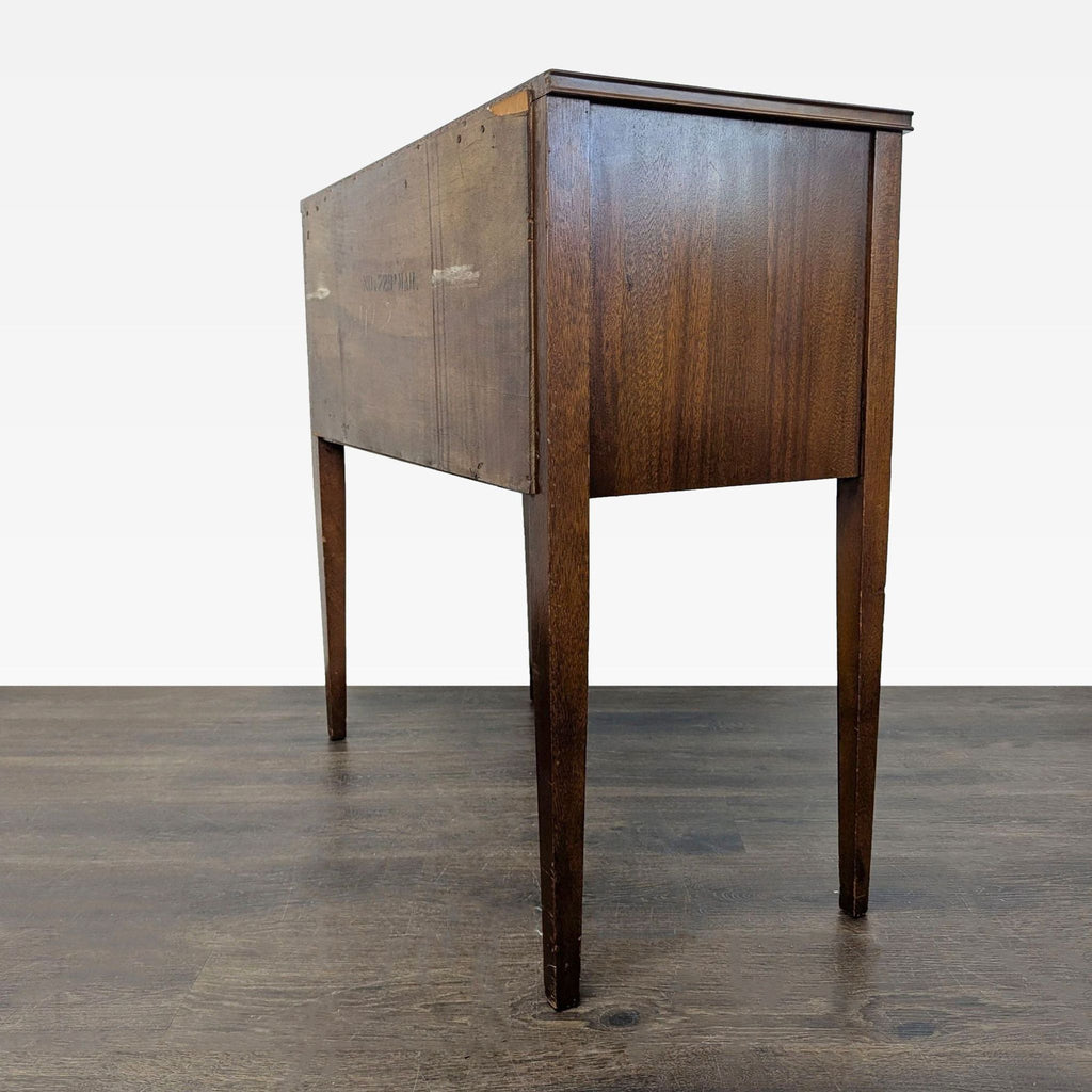 2. Rear view of a classic wooden console table, highlighting its clean lines and simple tapered legs.