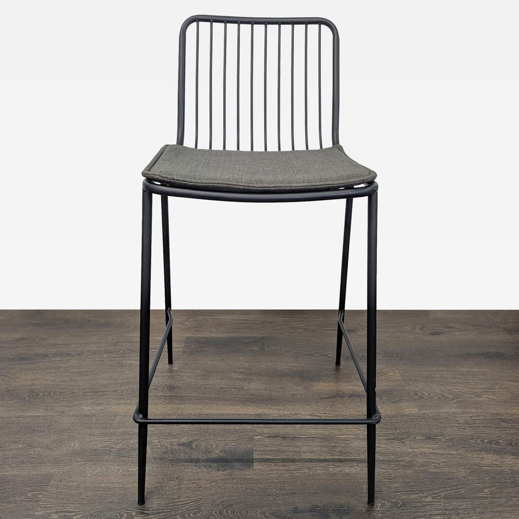 1. Black steel wire stool with round linen-cushioned seat and slatted backrest from Project 62.  