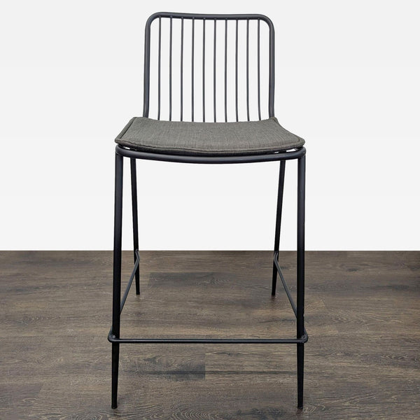 1. Black steel wire stool with round linen-cushioned seat and slatted backrest from Project 62.  