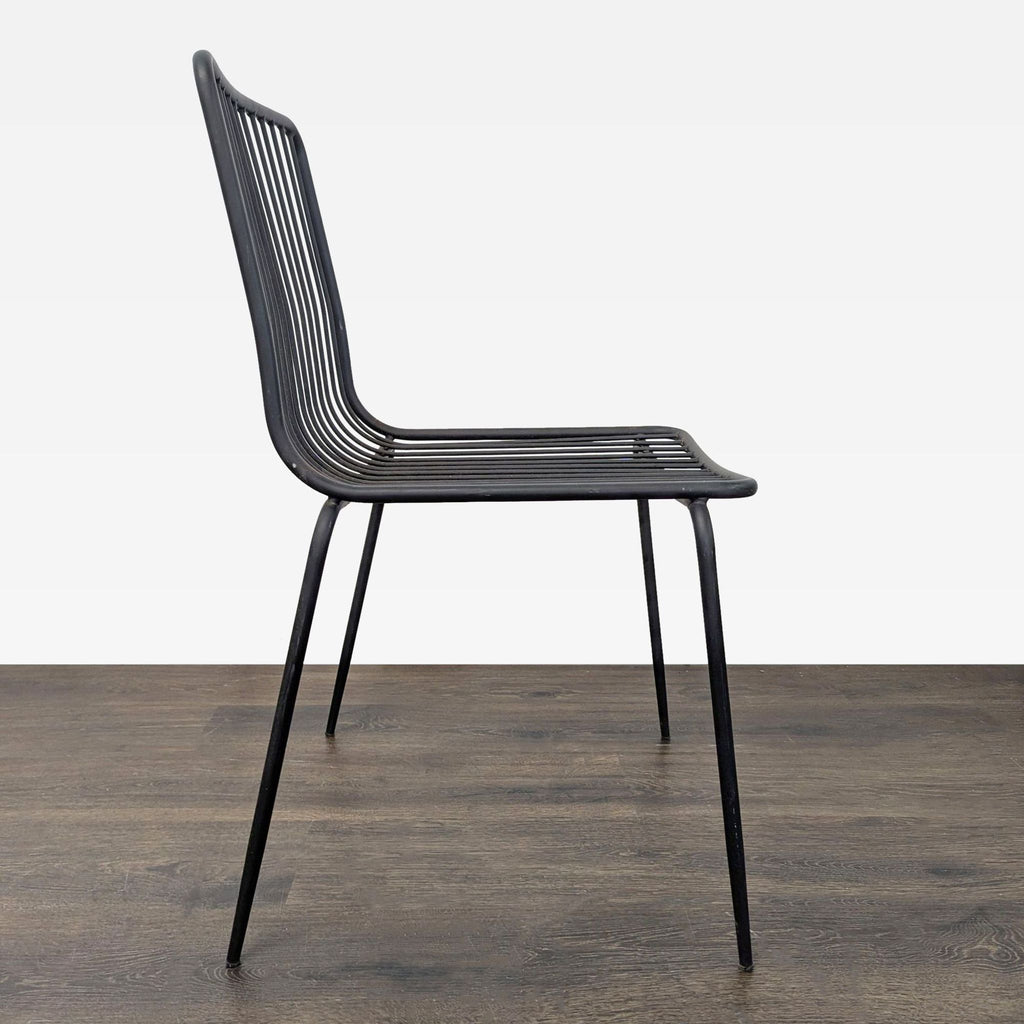 Modern black wire chair featuring a durable, easy-to-clean design perfect for various settings.