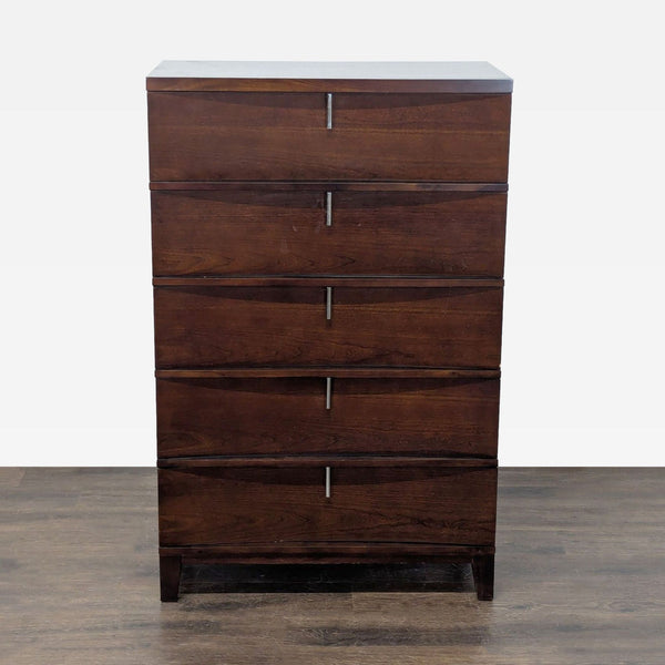 Dark wood dresser with five drawers and modern metal handles, offering stylish and spacious bedroom storage.