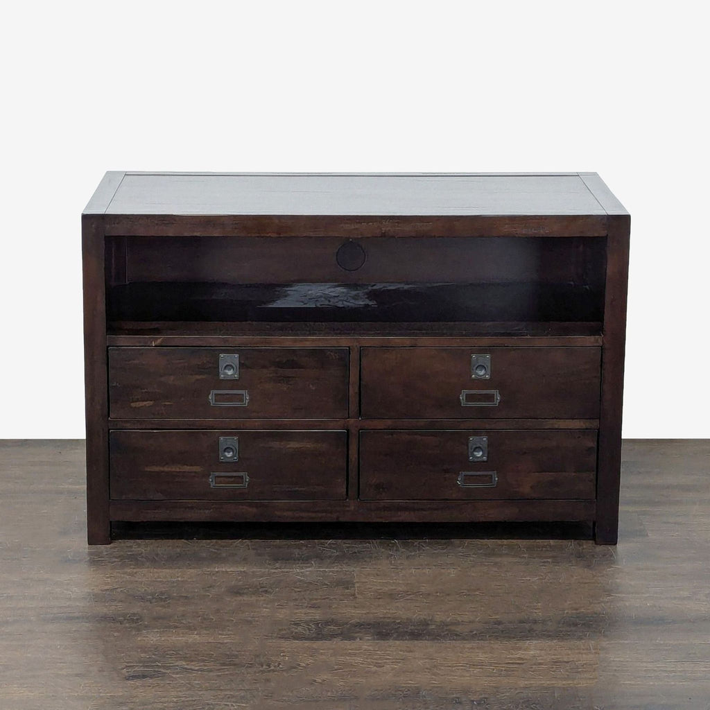 Pottery Barn entertainment center in dark wood, featuring four drawers and an open electronics shelf with cable cutout.  