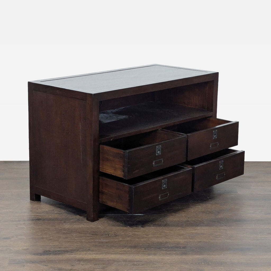 Classic dark wood Pottery Barn TV stand with four storage drawers and an open shelf for media devices.  