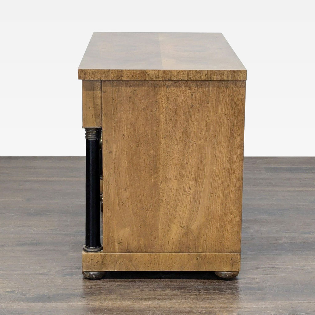 Three-drawer Baker dresser with sturdy build, black accents, and brass hardware, ideal for stylish storage.