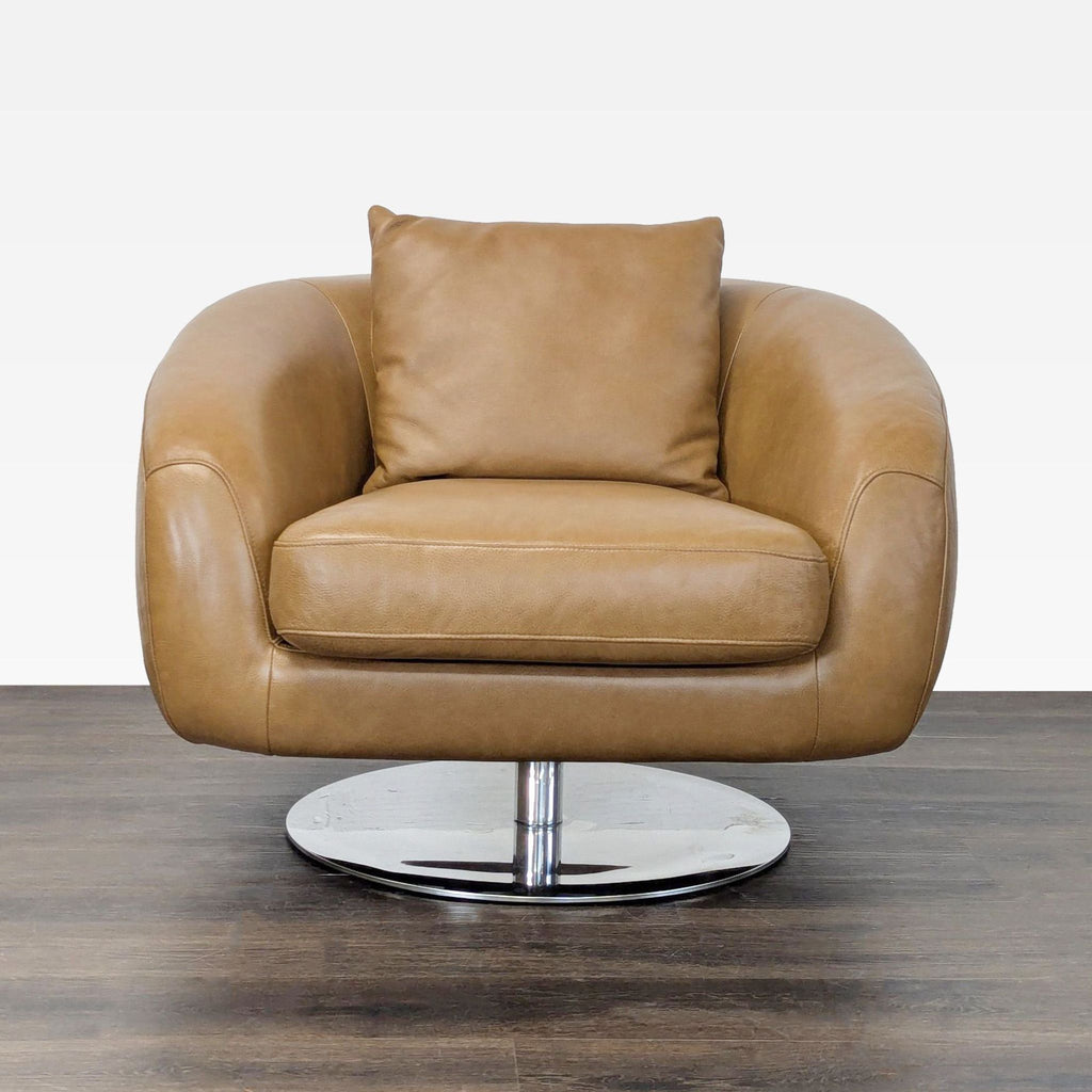 Modern tan leather lounge chair by Castlery with rounded design and chrome swivel base for living rooms.  
